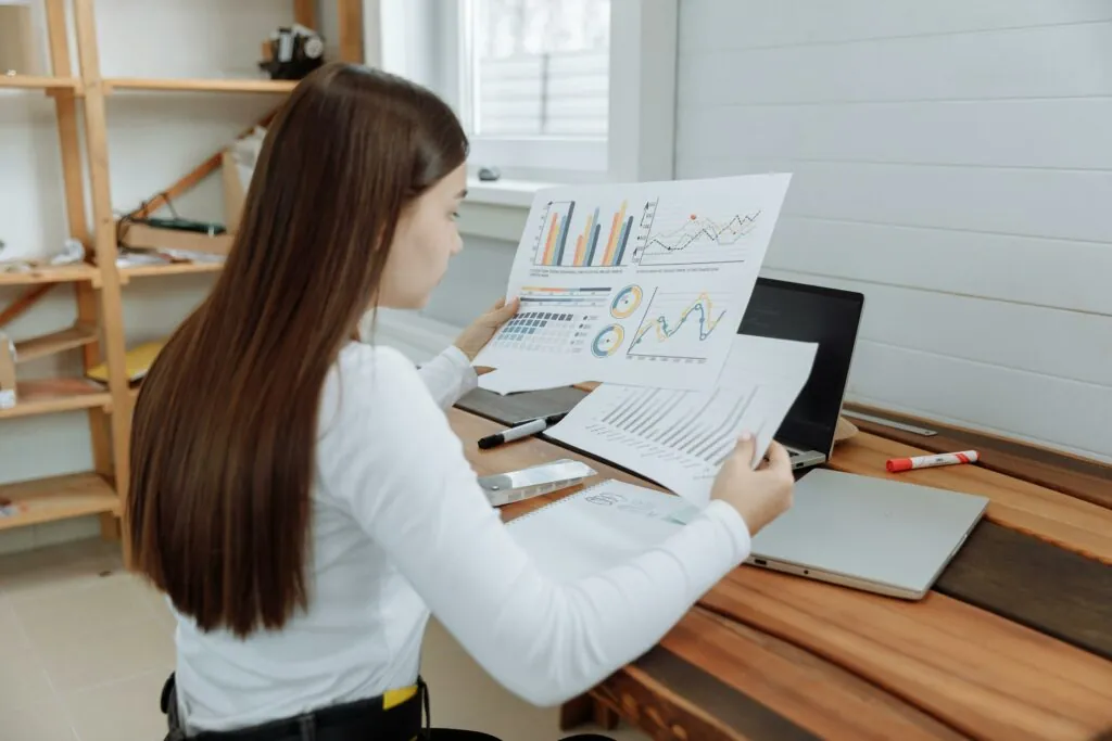 a woman looking at a paper